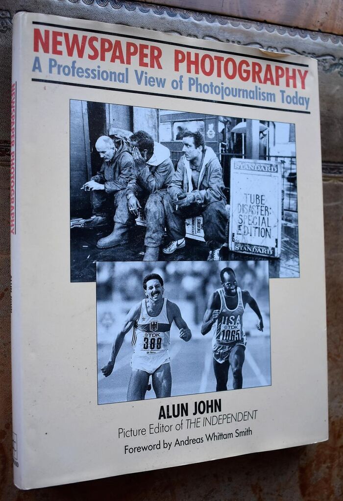 Newspaper Photography: Professional View of Photojournalism Today Image